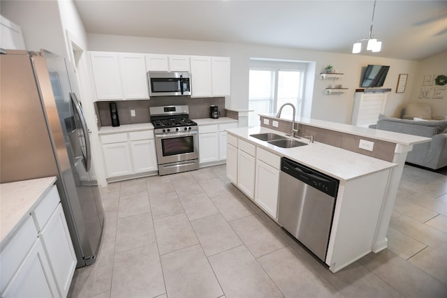 6926 Glenmoor Dr, Rosharon, TX 77583 - kitchen with appliances with stainless steel finishes, open floor plan, tasteful backsplash, and white cabinetry