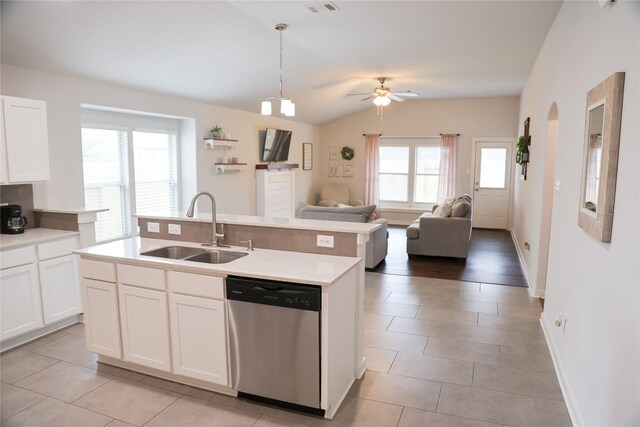 6926 Glenmoor Dr, Rosharon, TX 77583 - kitchen with stainless steel dishwasher, light countertops, ceiling fan, lofted ceiling, and open floor plan