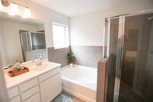 6926 Glenmoor Dr, Rosharon, TX 77583 - bathroom featuring vanity, a bath, and a stall shower