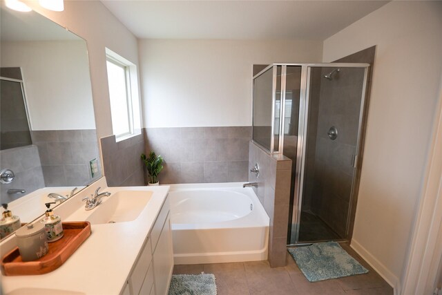 6926 Glenmoor Dr, Rosharon, TX 77583 - bathroom featuring tile patterned flooring, a garden tub, a shower stall, and vanity