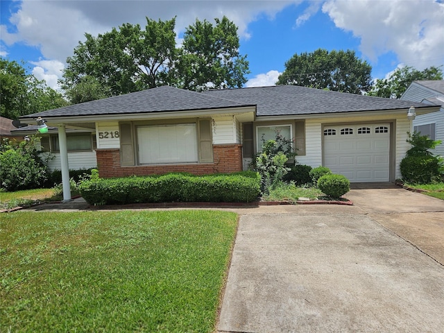 5218 Cortelyou Ln, Houston, TX 77021 - view of front facade featuring a front lawn, brick siding, concrete driveway, and a shingled roof