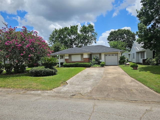 5218 Cortelyou Ln, Houston, TX 77021 - ranch-style house with a garage, concrete driveway, a front lawn, and brick siding