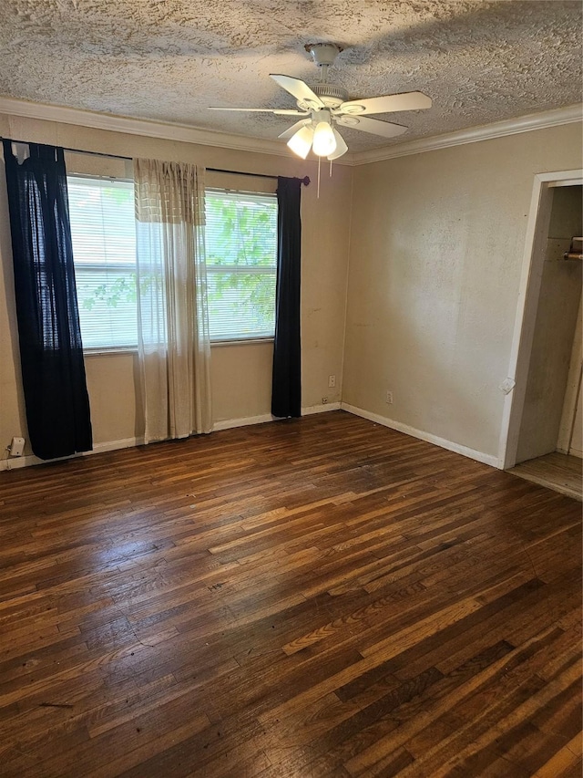 5218 Cortelyou Ln, Houston, TX 77021 - spare room featuring crown molding, dark wood finished floors, a ceiling fan, and a textured ceiling