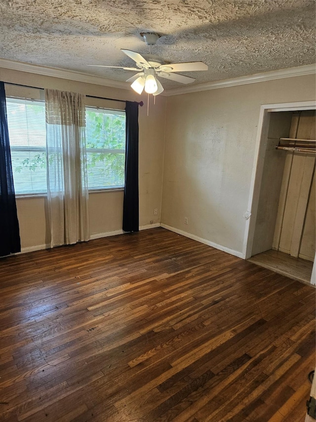 5218 Cortelyou Ln, Houston, TX 77021 - unfurnished bedroom with ornamental molding, dark wood-style flooring, a ceiling fan, and a textured ceiling