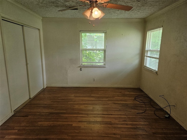5218 Cortelyou Ln, Houston, TX 77021 - unfurnished bedroom with wood finished floors, crown molding, a closet, a textured ceiling, and ceiling fan