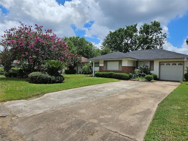 5218 Cortelyou Ln, Houston, TX 77021 - view of front of property with driveway, a garage, a front lawn, brick siding, and roof with shingles