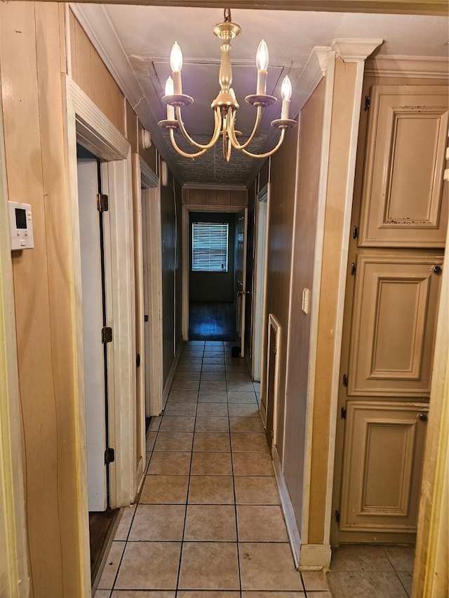 5218 Cortelyou Ln, Houston, TX 77021 - hall featuring a chandelier, light tile patterned flooring, and ornamental molding
