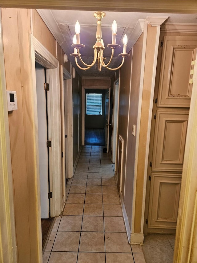 5218 Cortelyou Ln, Houston, TX 77021 - hallway with a chandelier, ornamental molding, and light tile patterned floors