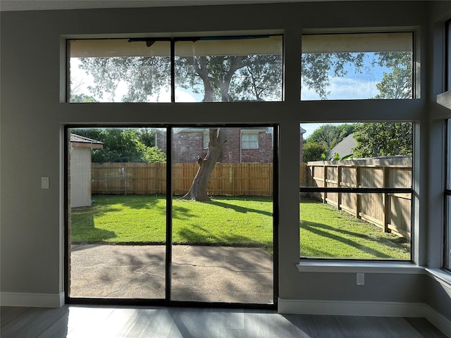 2922 Field Line Dr, Sugar Land, TX 77479 - doorway with baseboards and wood finished floors