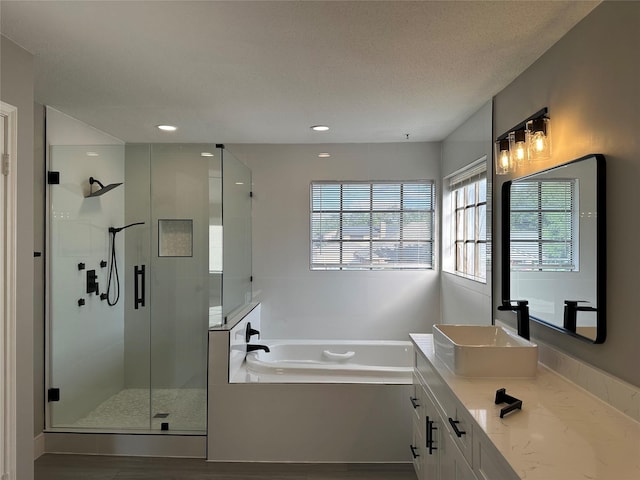2922 Field Line Dr, Sugar Land, TX 77479 - bathroom with a garden tub, a stall shower, vanity, and recessed lighting