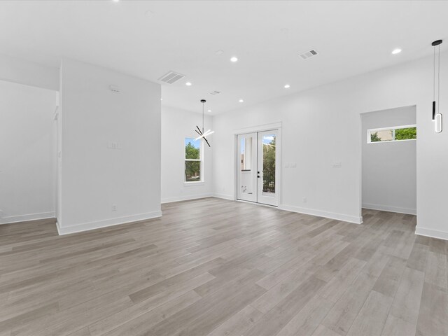 1264 Finnigan St, Houston, TX 77020 - empty room with plenty of natural light, light wood-style floors, and recessed lighting