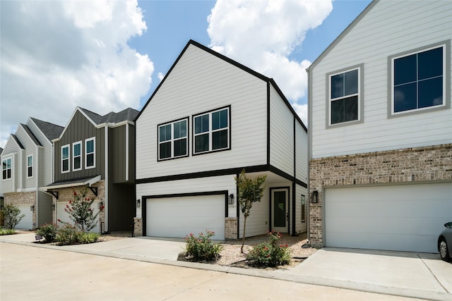 11325 Stonework Garden Ln, Houston, TX 77076 - view of front of property with driveway, an attached garage, and brick siding