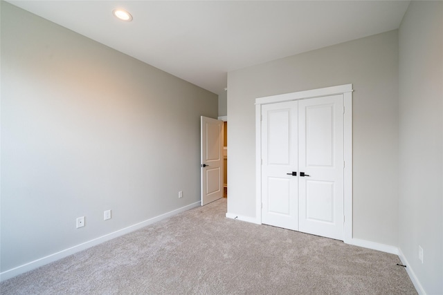11325 Stonework Garden Ln, Houston, TX 77076 - unfurnished bedroom featuring carpet, a closet, and recessed lighting