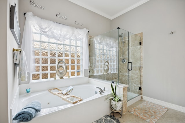 1155 Rustling Wind Ln, League City, TX 77573 - bathroom with a tub with jets, a stall shower, ornamental molding, healthy amount of natural light, and tile patterned flooring