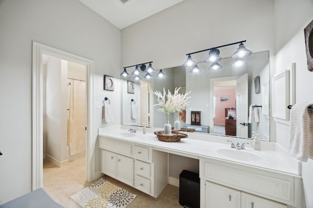 1155 Rustling Wind Ln, League City, TX 77573 - bathroom with double vanity and tile patterned floors