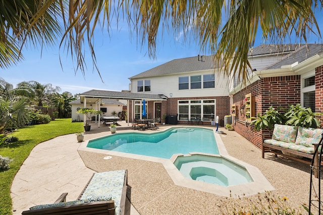 1155 Rustling Wind Ln, League City, TX 77573 - view of swimming pool with a patio, a pool with connected hot tub, a yard, and outdoor dining space