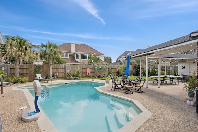 1155 Rustling Wind Ln, League City, TX 77573 - view of pool featuring a patio area, a fenced backyard, and a pool with connected hot tub