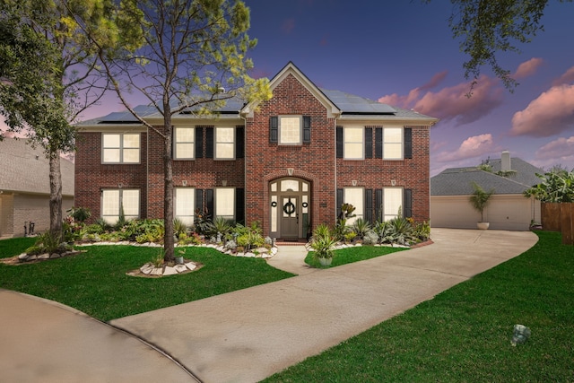 1155 Rustling Wind Ln, League City, TX 77573 - view of front of house with a front yard, driveway, a garage, and brick siding