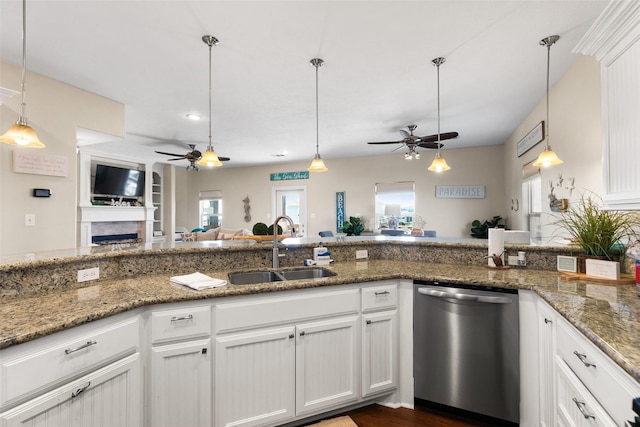 862 Gregory Ln, Port Bolivar, TX 77650 - kitchen with stainless steel dishwasher, a ceiling fan, open floor plan, decorative light fixtures, and recessed lighting