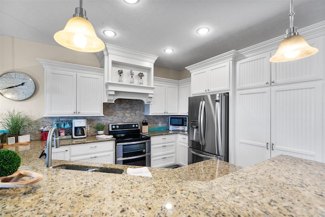 862 Gregory Ln, Port Bolivar, TX 77650 - kitchen featuring appliances with stainless steel finishes, custom exhaust hood, white cabinets, a textured ceiling, and recessed lighting