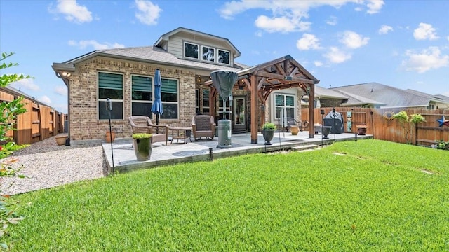4542 Shallow Ember Dr, Spring, TX 77386 - back of house featuring brick siding, a patio, and a fenced backyard