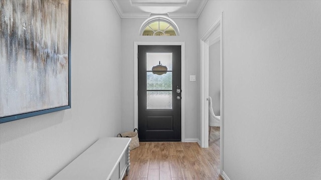 4542 Shallow Ember Dr, Spring, TX 77386 - doorway featuring light wood finished floors and crown molding