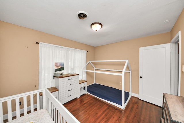 418 Forrest St, Baytown, TX 77520 - bedroom featuring dark wood-style floors and baseboards