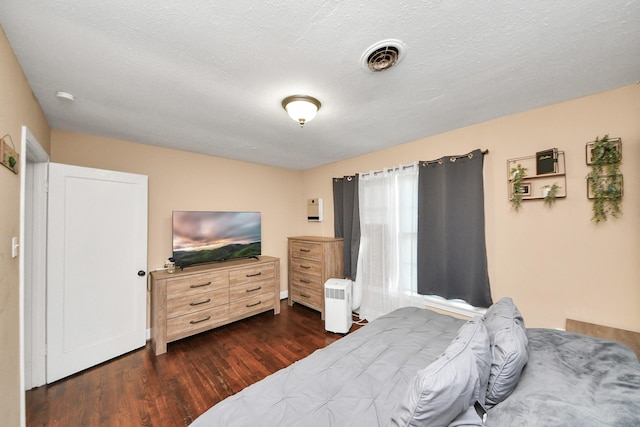 418 Forrest St, Baytown, TX 77520 - bedroom featuring dark wood finished floors