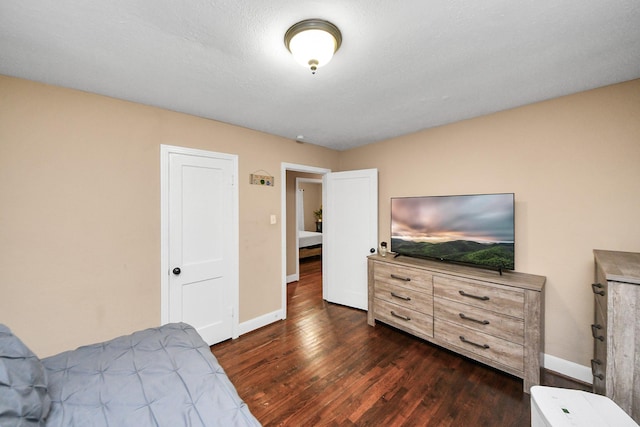 418 Forrest St, Baytown, TX 77520 - bedroom featuring dark wood-style flooring