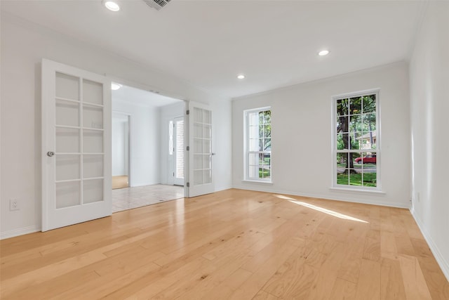 13631 Balmore Cir, Houston, TX 77069 - spare room featuring french doors, light wood-type flooring, ornamental molding, and recessed lighting