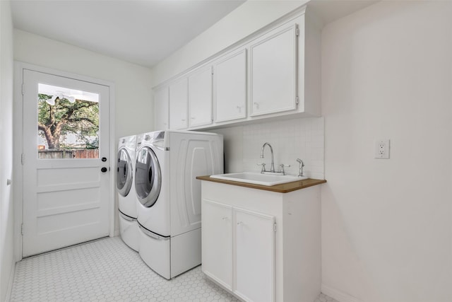 13631 Balmore Cir, Houston, TX 77069 - laundry room with separate washer and dryer and cabinet space