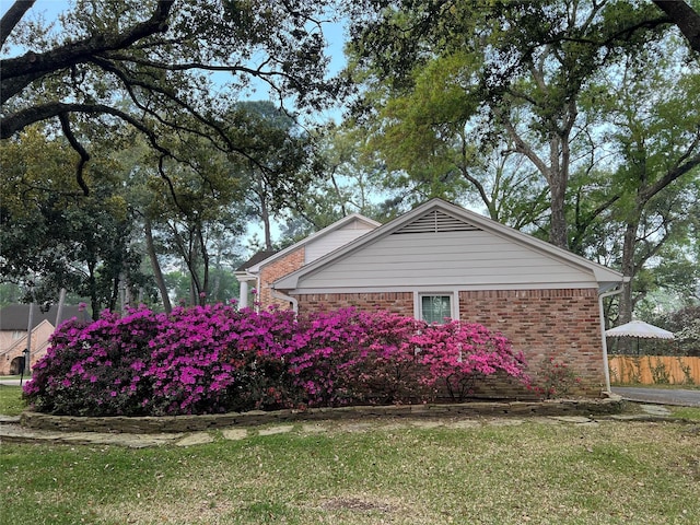 13631 Balmore Cir, Houston, TX 77069 - view of home's exterior with brick siding