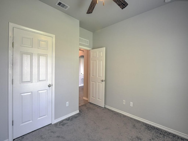 3635 W L Breeding Dr, Corpus Christi, TX 78414 - unfurnished bedroom featuring carpet, arched walkways, and ceiling fan