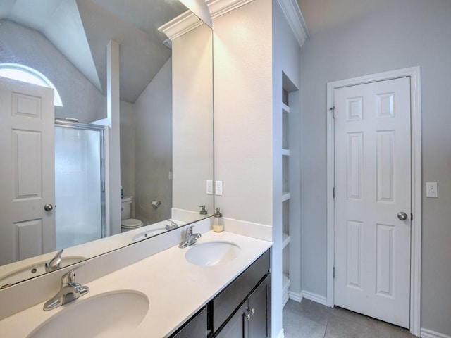 3635 W L Breeding Dr, Corpus Christi, TX 78414 - full bathroom with a shower stall, double vanity, tile patterned flooring, vaulted ceiling, and crown molding