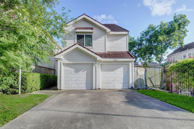 5651 Pine St, Houston, TX 77081 - view of front facade featuring concrete driveway, an attached garage, and a tile roof