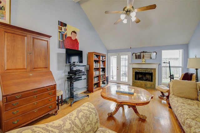 5651 Pine St, Houston, TX 77081 - living area with light wood-style flooring, high vaulted ceiling, ceiling fan, and healthy amount of natural light