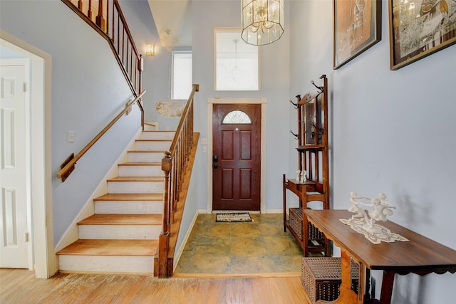 5651 Pine St, Houston, TX 77081 - foyer with stairs, a chandelier, and a high ceiling