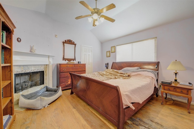 5651 Pine St, Houston, TX 77081 - bedroom featuring lofted ceiling, light wood-style floors, a fireplace, a ceiling fan, and a closet