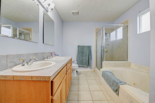 5651 Pine St, Houston, TX 77081 - full bath with a stall shower, double vanity, a tub with jets, and tile patterned floors