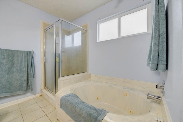 5651 Pine St, Houston, TX 77081 - bathroom with a shower stall, a whirlpool tub, and tile patterned flooring