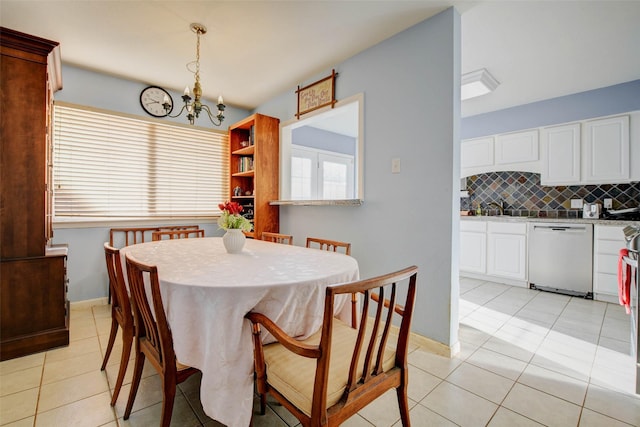5651 Pine St, Houston, TX 77081 - dining room featuring a chandelier and light tile patterned floors