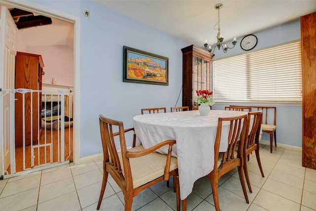 5651 Pine St, Houston, TX 77081 - dining area featuring a chandelier and light tile patterned floors