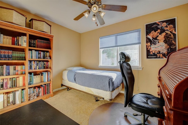 5651 Pine St, Houston, TX 77081 - carpeted bedroom featuring a ceiling fan