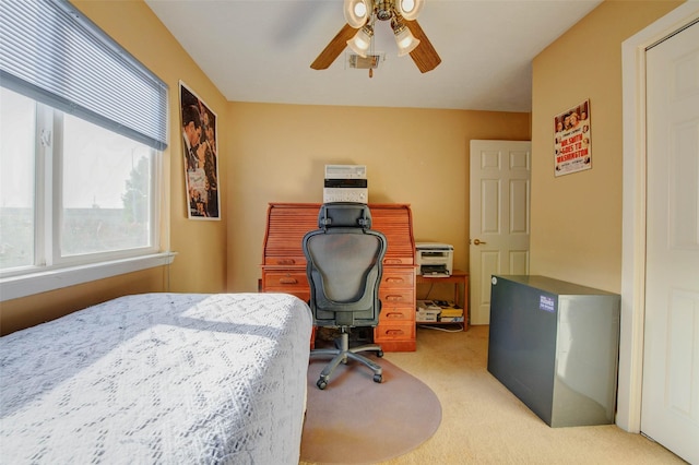 5651 Pine St, Houston, TX 77081 - bedroom featuring light colored carpet, an office area, and ceiling fan