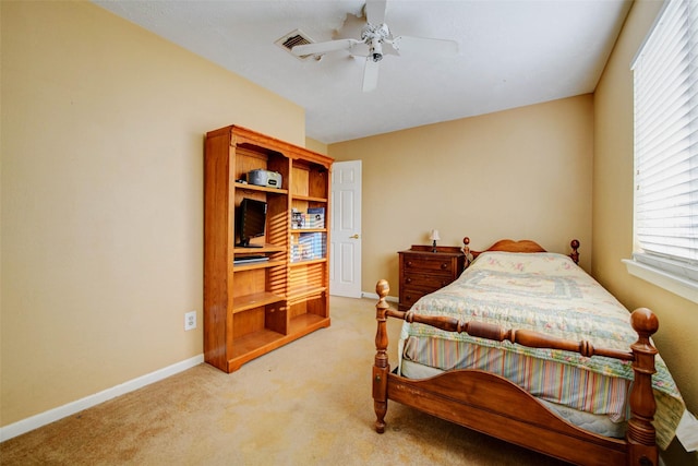 5651 Pine St, Houston, TX 77081 - bedroom featuring light carpet, multiple windows, and a ceiling fan