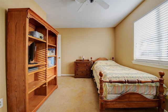 5651 Pine St, Houston, TX 77081 - bedroom with light colored carpet and ceiling fan