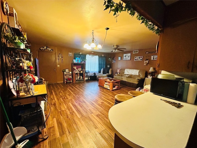 102 Draper St, Columbus, TX 78934 - living area with light wood-style floors, ceiling fan, and a chandelier