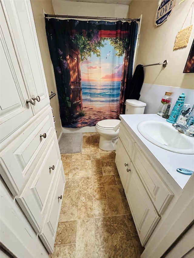 102 Draper St, Columbus, TX 78934 - full bath featuring stone finish floors, vanity, and curtained shower
