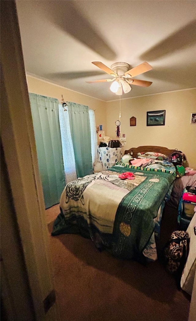 102 Draper St, Columbus, TX 78934 - bedroom with ceiling fan and carpet flooring