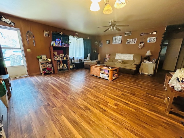 102 Draper St, Columbus, TX 78934 - living room featuring wood finished floors, ceiling fan, and a chandelier
